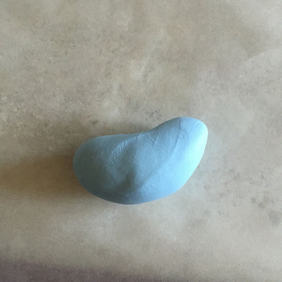 Pull one side upwards to start forming a head.