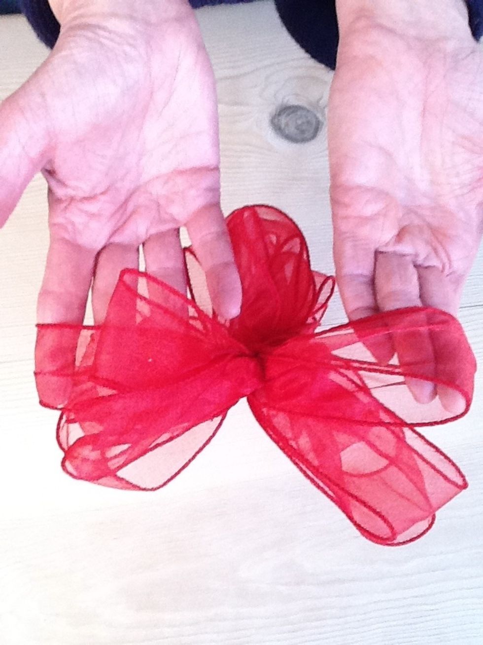 Pull opposing sides apart to create a bow