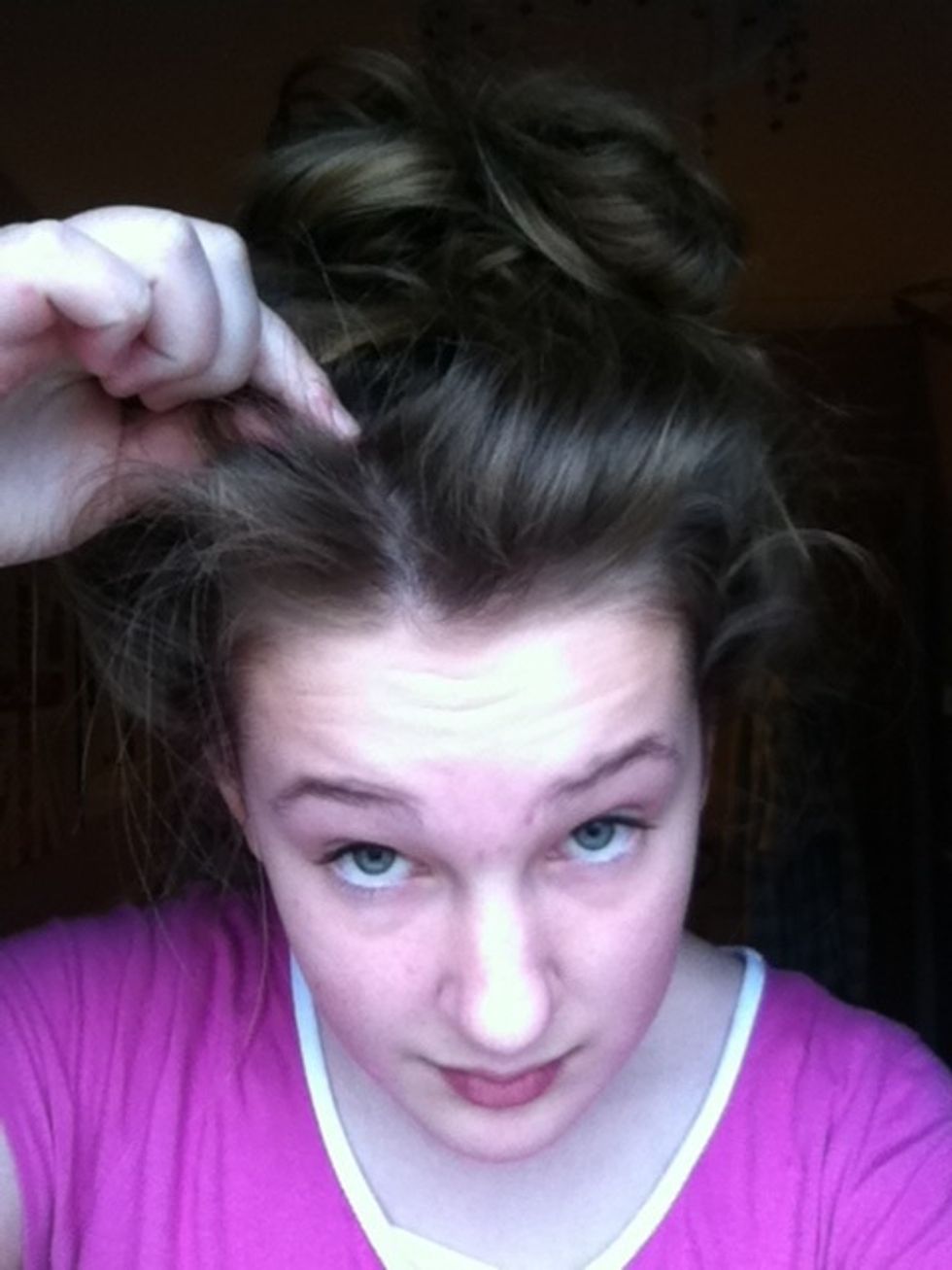 Pull out bits of your hair to create a messy look