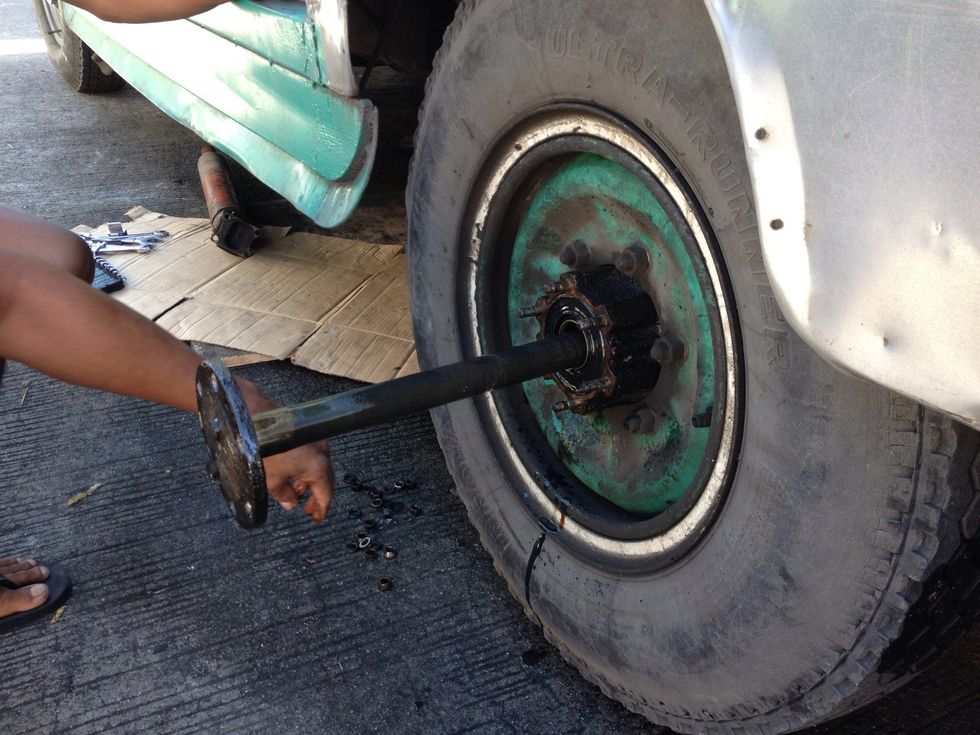 Pull out the center stud to give  access to the leaky oil seal.