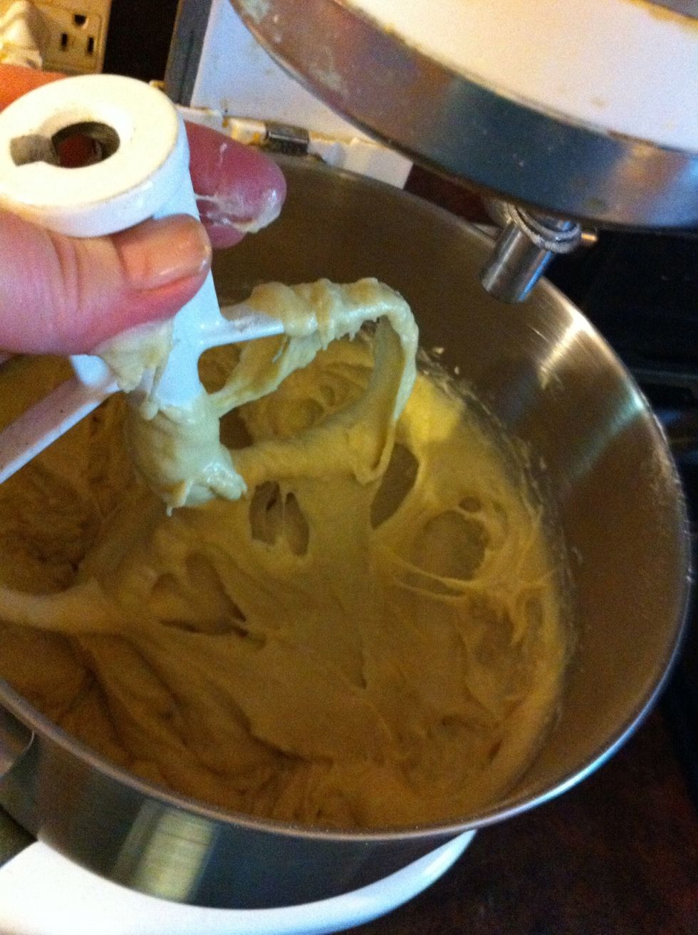 Pull out the paddle. Pull off the dough stuck to it.