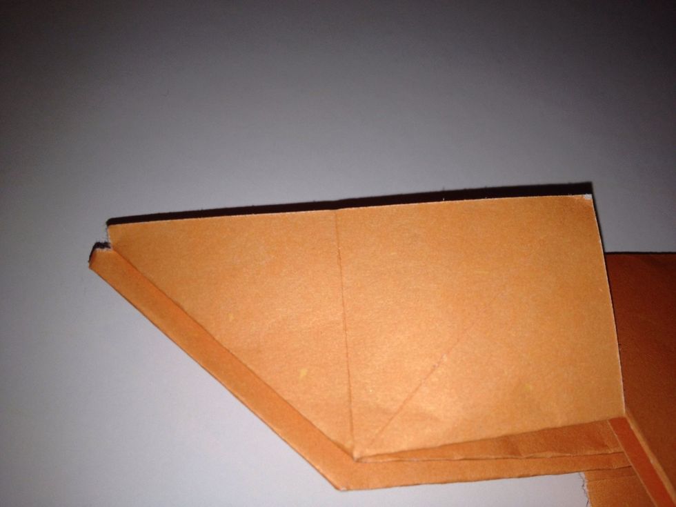 Pull out the paper so that it flattens down