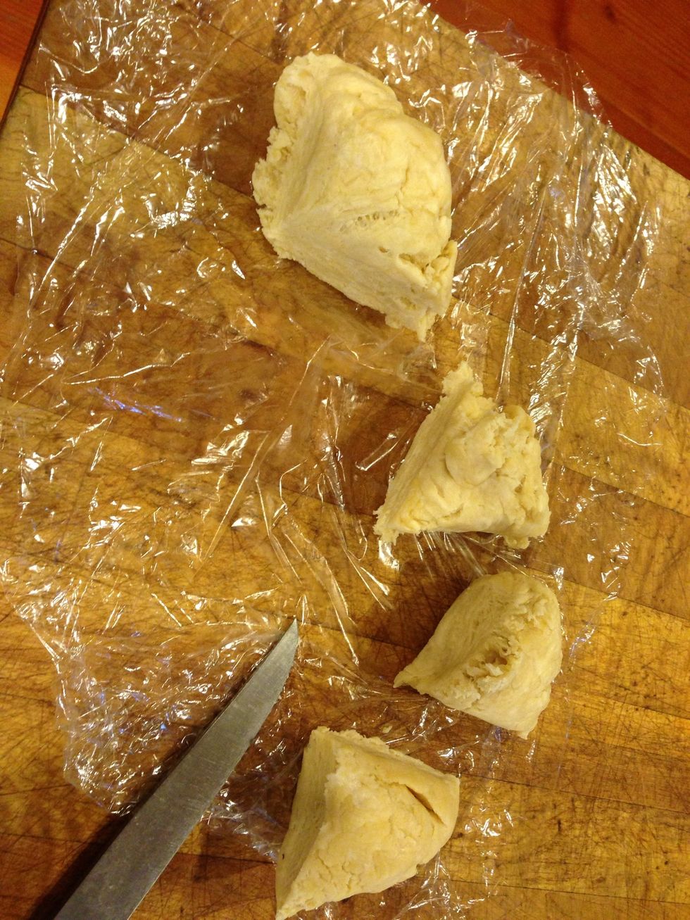 Pull out your dough and cut into four pieces.
