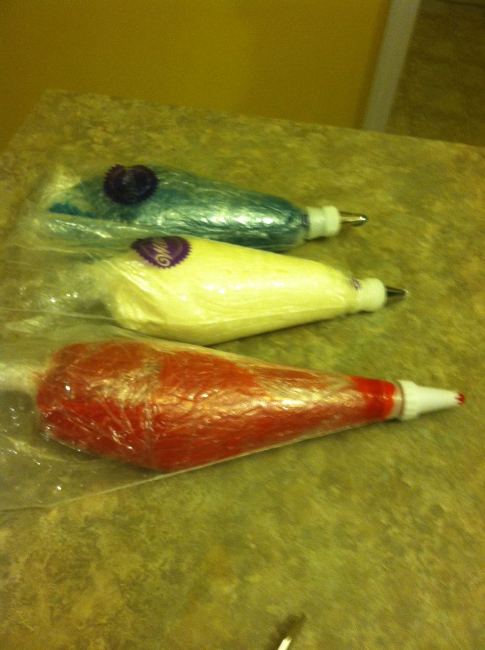 Pull Saran wrap icing bag through your Wilton icing bag. Martha stewart's got nothing on us!!!