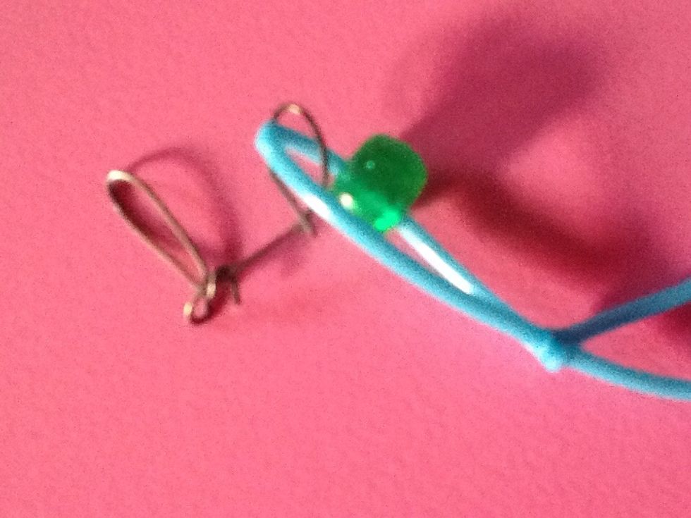 Pull so there is 1 inch between the sliding knot and charm