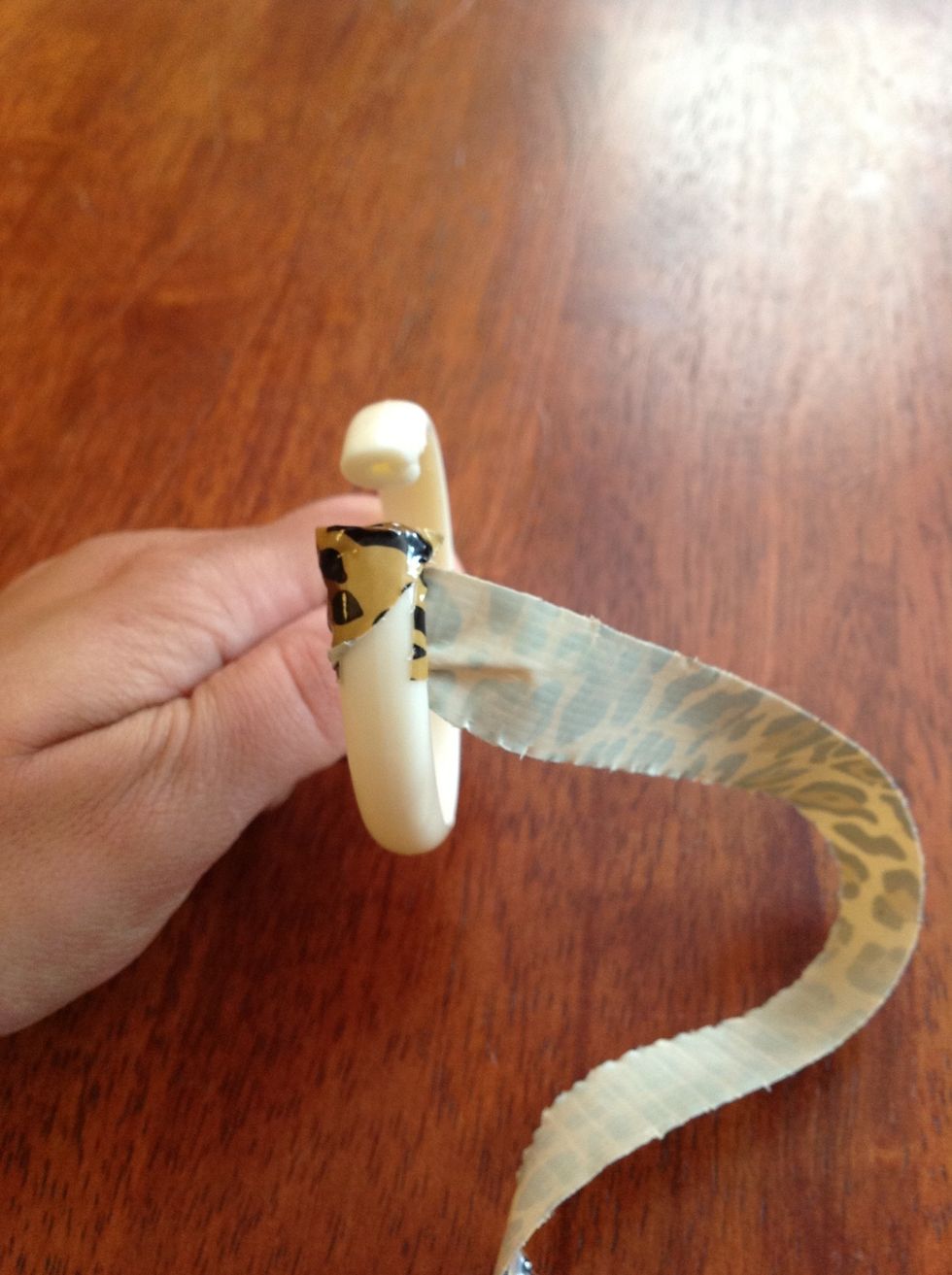 Pull tape tightly at an angle around the shower ring.continue to wrap this way until you either run out of tape or get to the end. Finish the other end of the ring the same way you began.