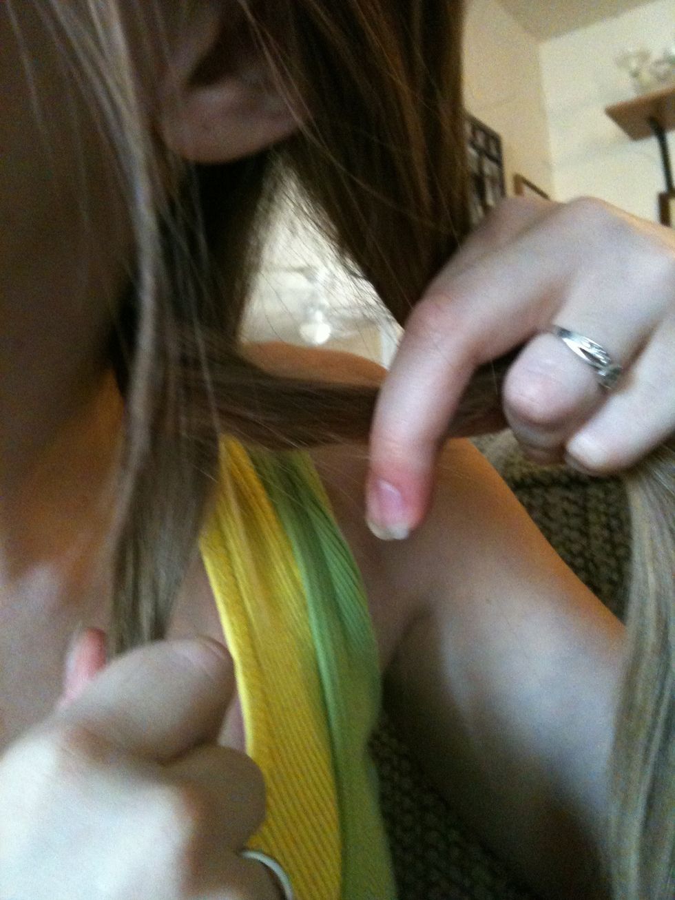 Pull that small section of hair across the big section you pulled it out of and into the other big section.