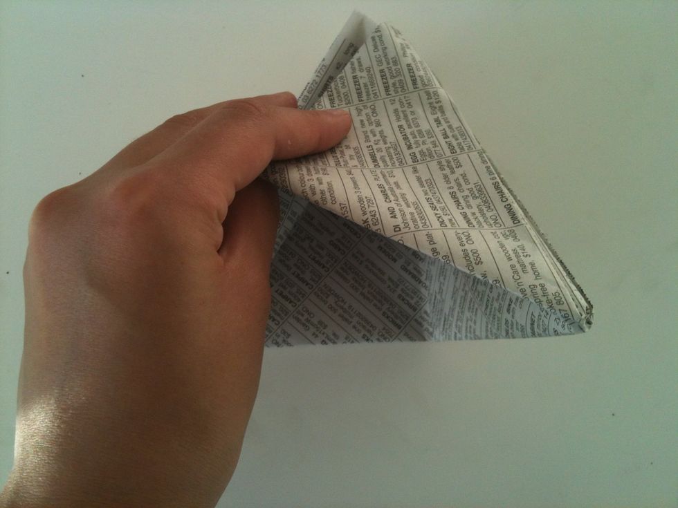 Pull the bottom open and fold down the other way.