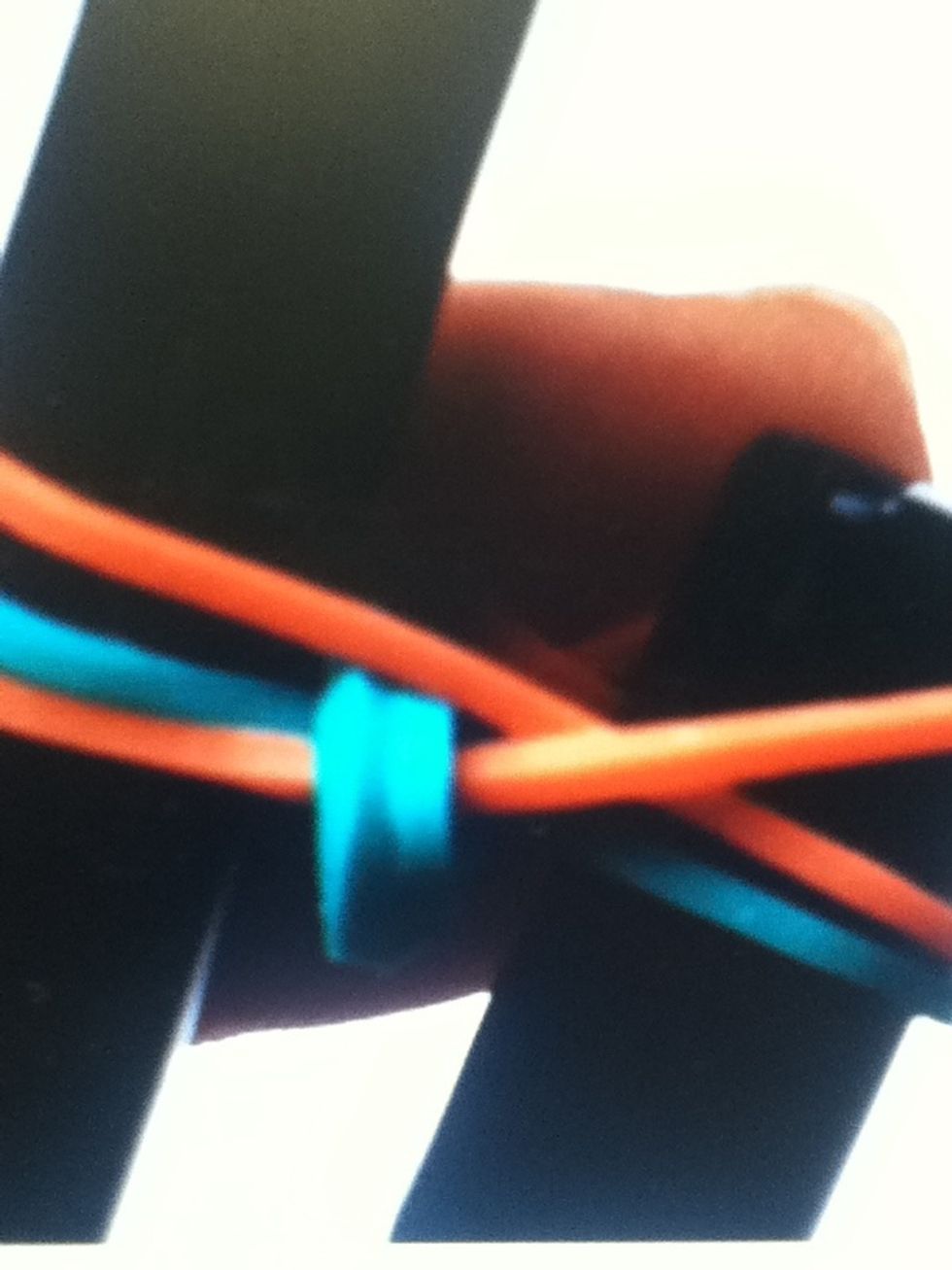 Pull the bottom right elastic over the pen.