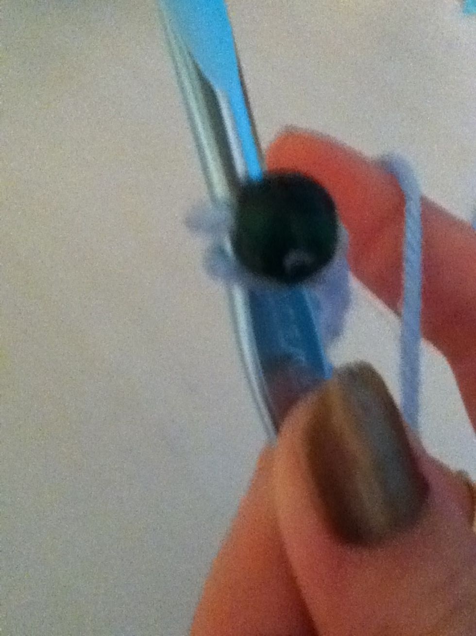 Pull the bottom yarn over the bead
