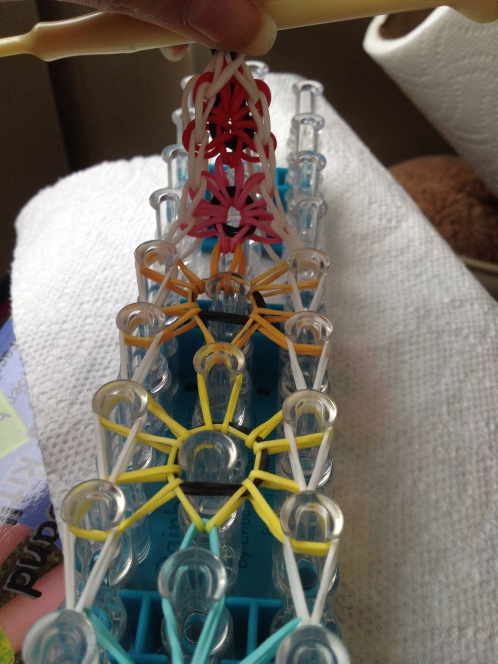 Pull the bracelet off the loom.