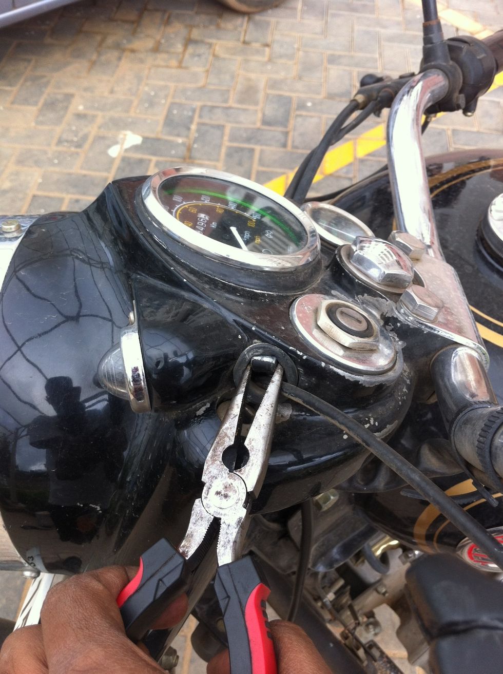 Pull the cable end using a nose plier