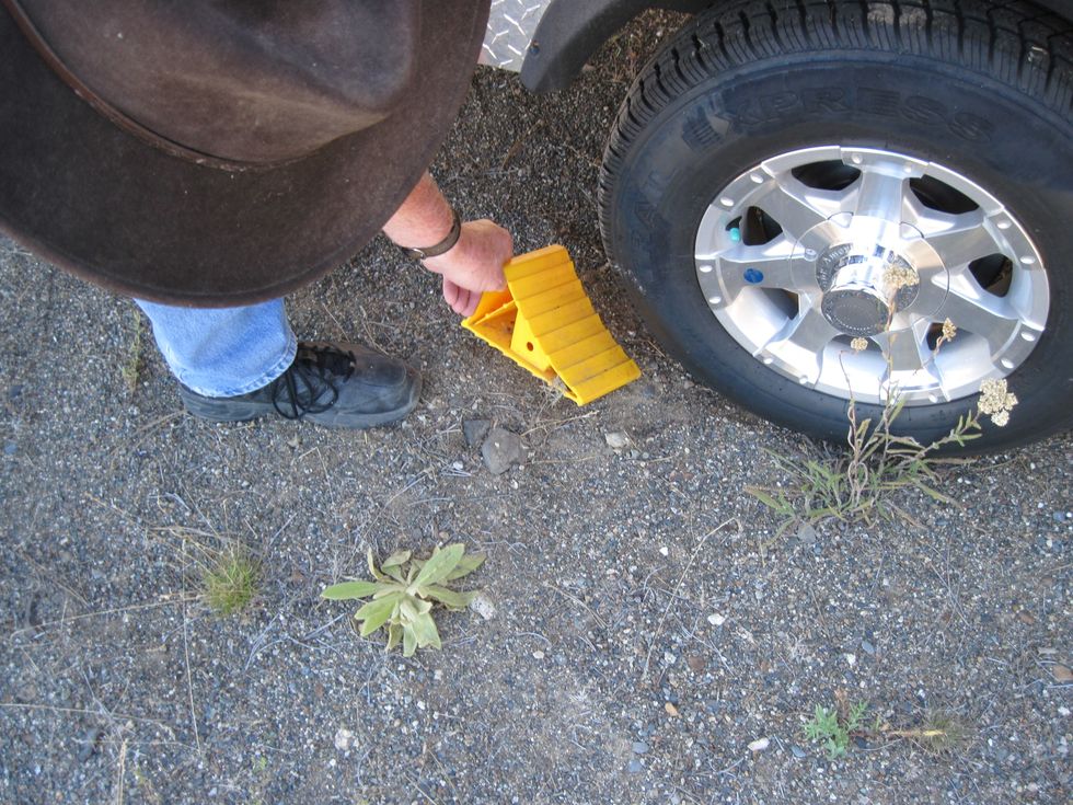 Pull the chocks that kept the wheels in place. Put them in the trailer.