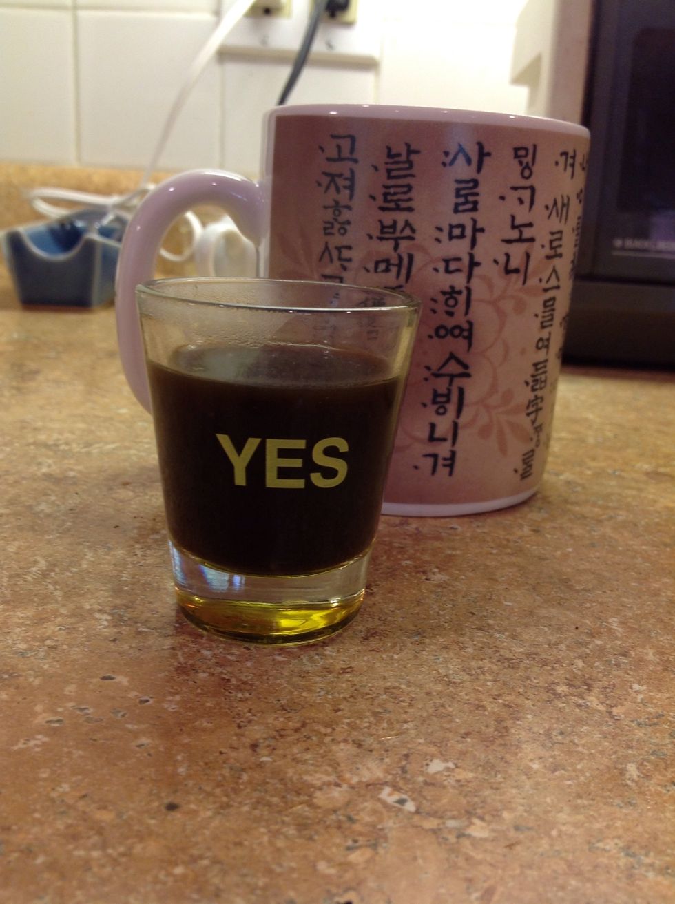 Pull the coffee from the stove. Pour three one ounce shots into your mug (or two; your choice). Add sugar to taste.