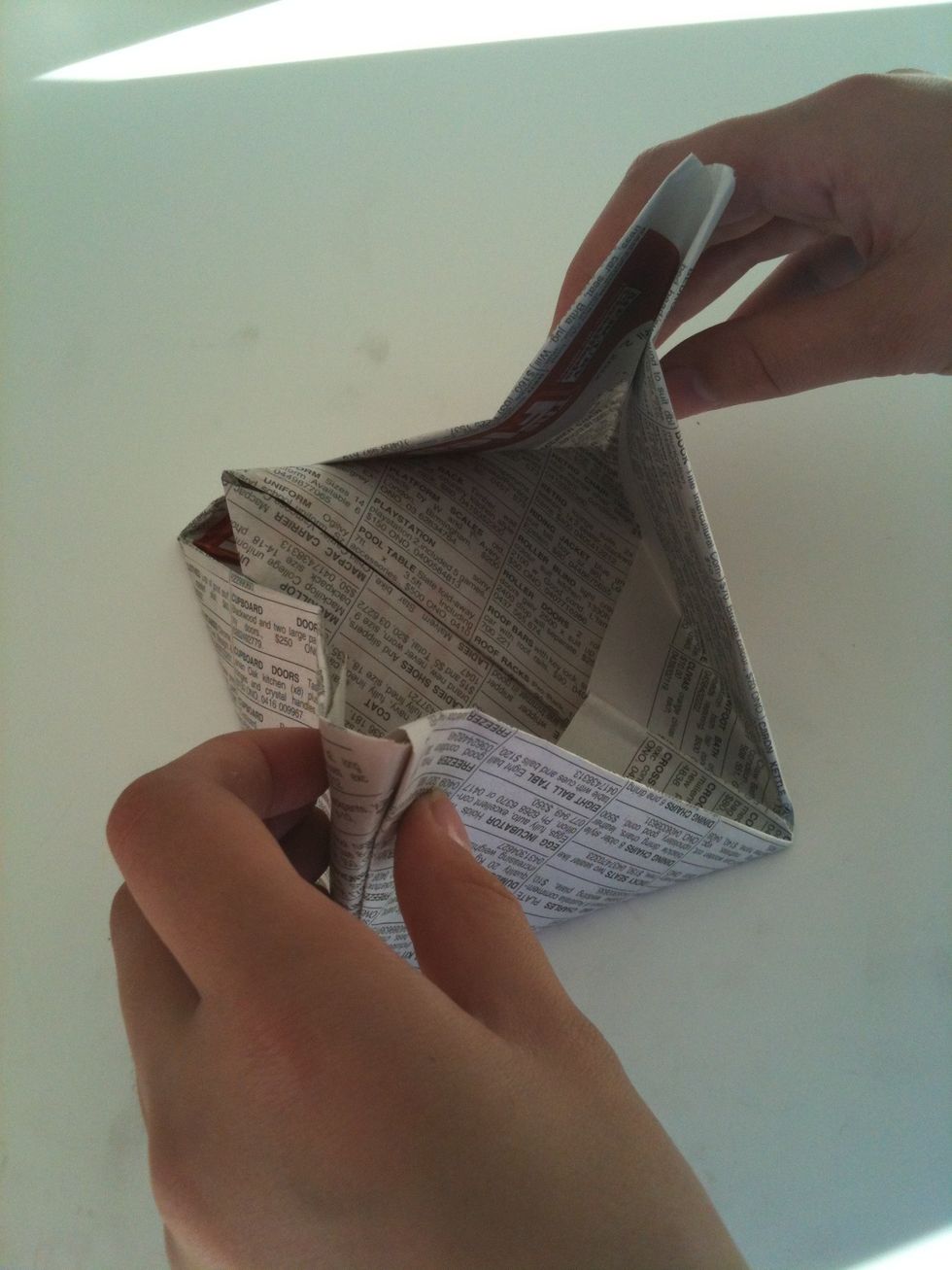 Pull the corners apart then open.