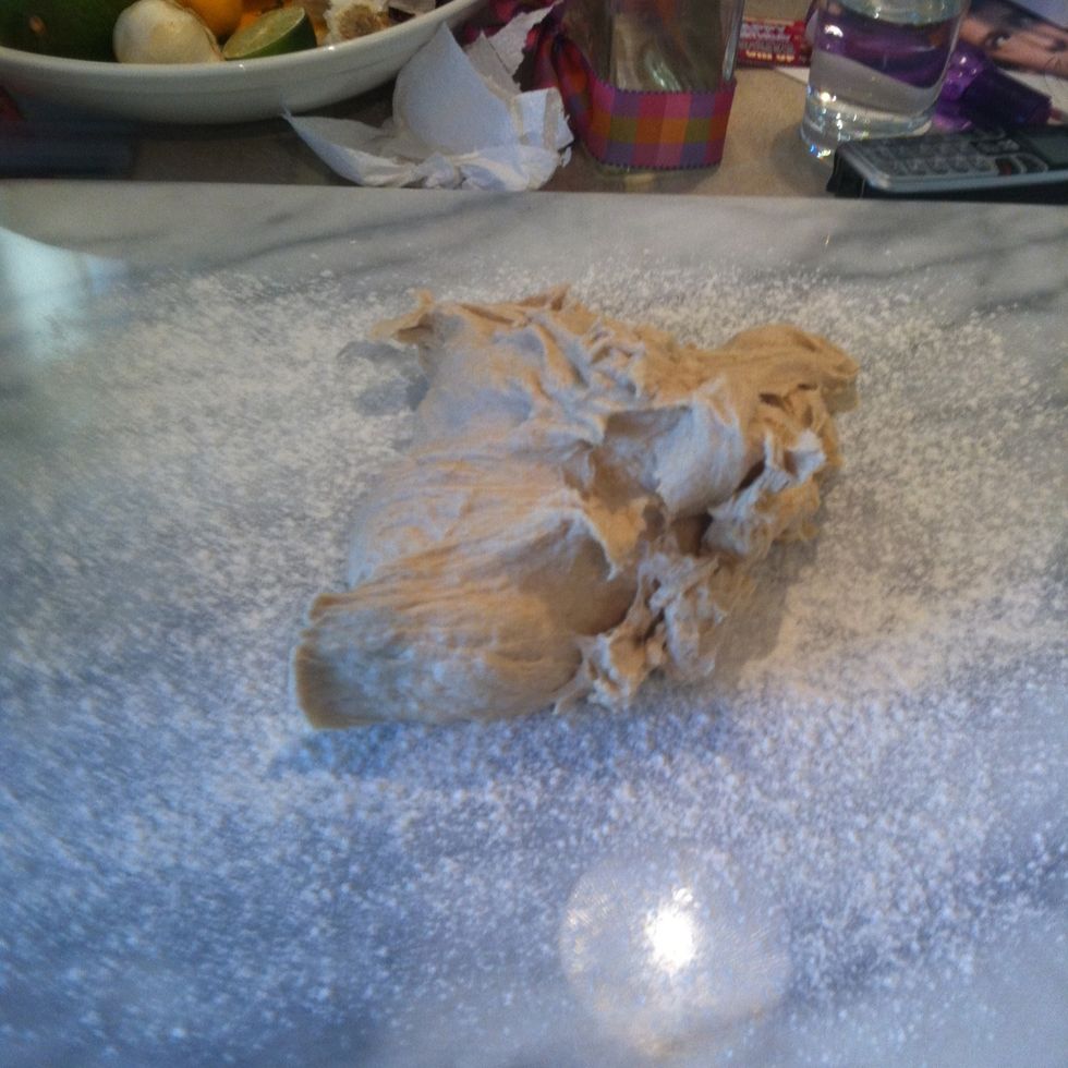 Pull the dough out on to a smooth, flowered surface.