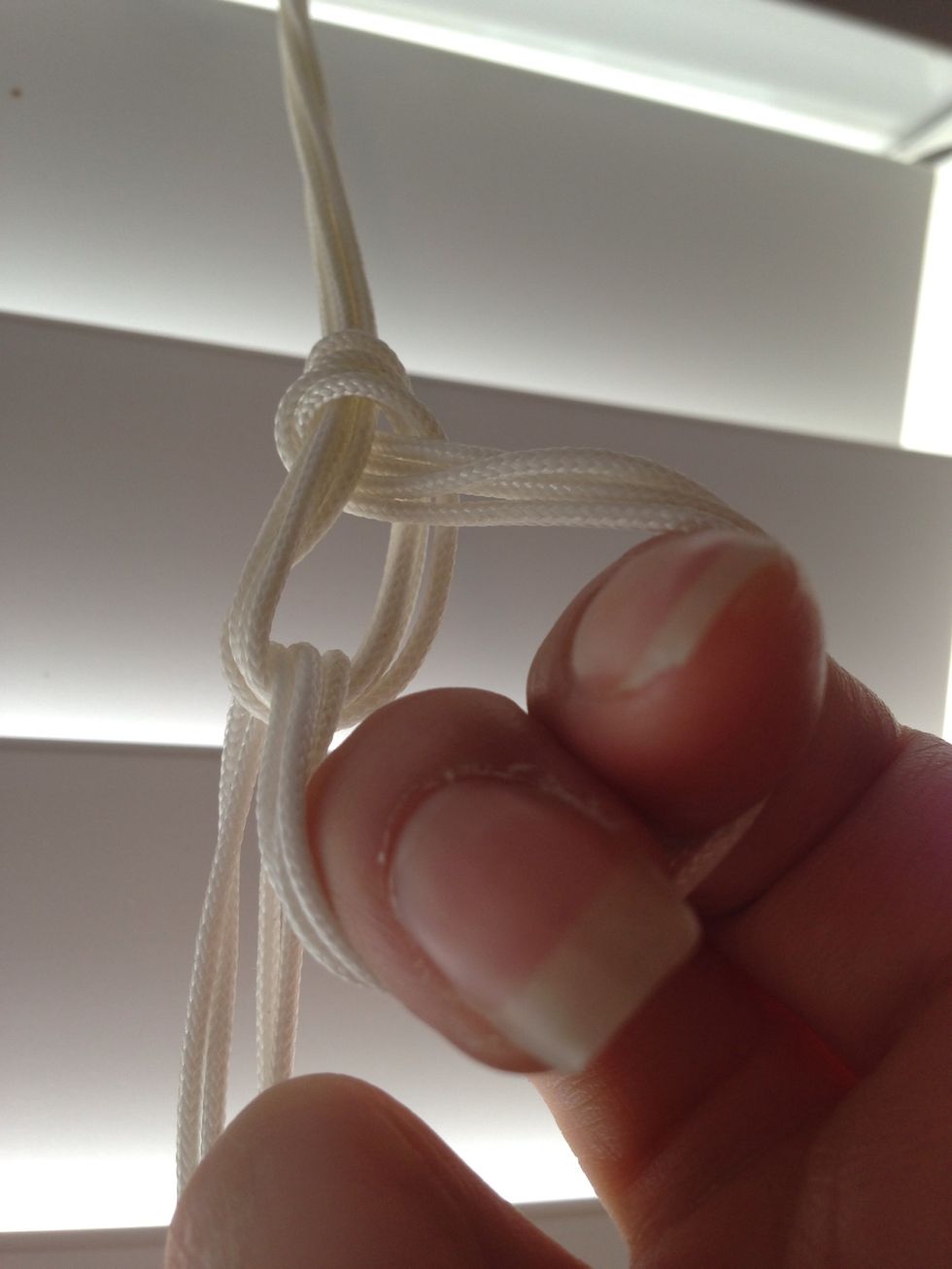 Pull the ends through to create a loop.