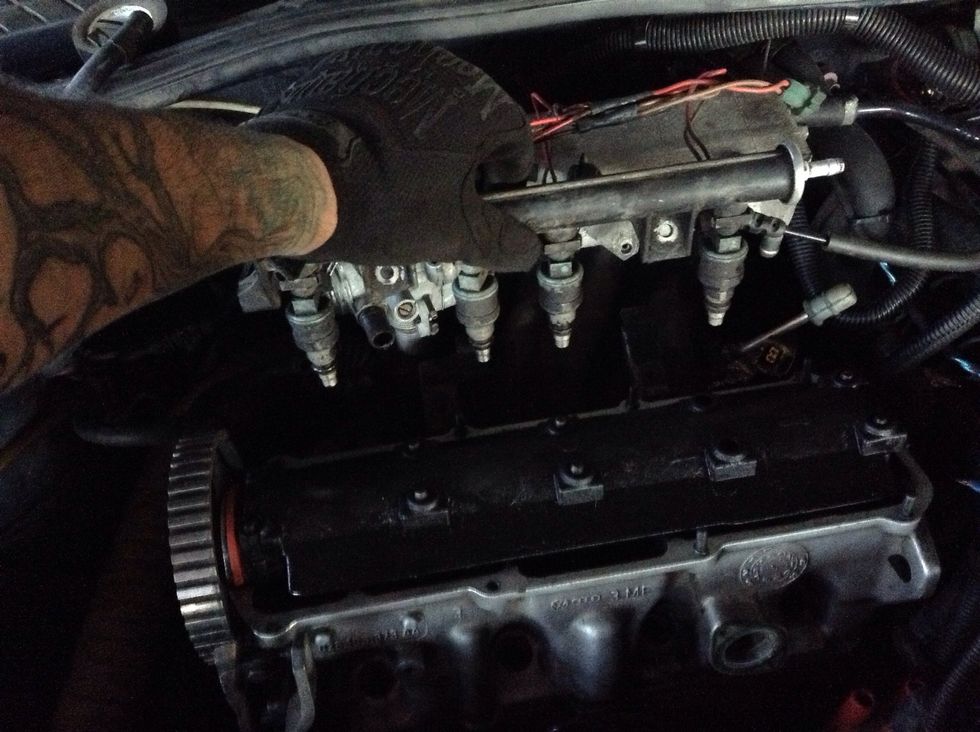 Pull the fuel rail (with injectors) from the head. This will require some shimmying and a good amount off effort.