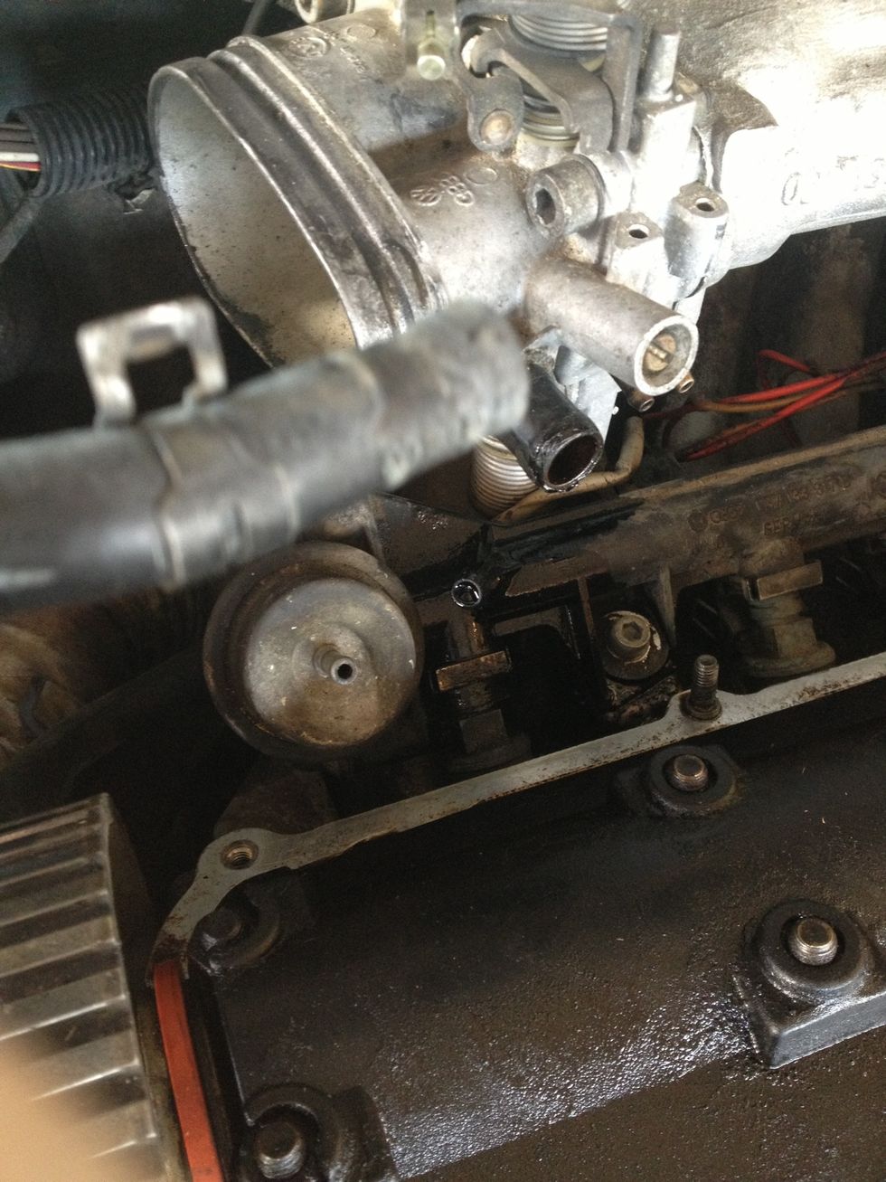 Pull the fuel supply line from the fuel rail.