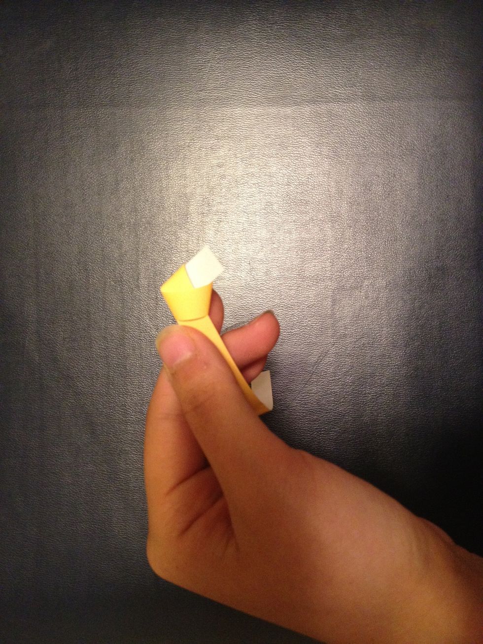 Pull the knot to one end so that a small section is left.