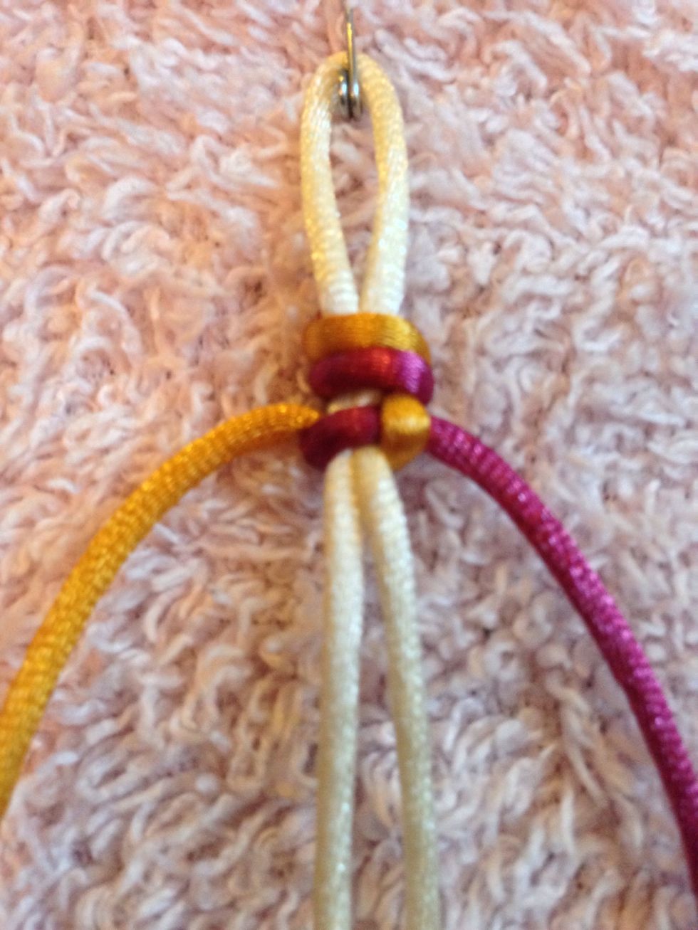 Pull the LEFT and RIGHT threads until the reach the knot and pull tight. (Sometimes the core travels up too, don't worry just pull it straight again).