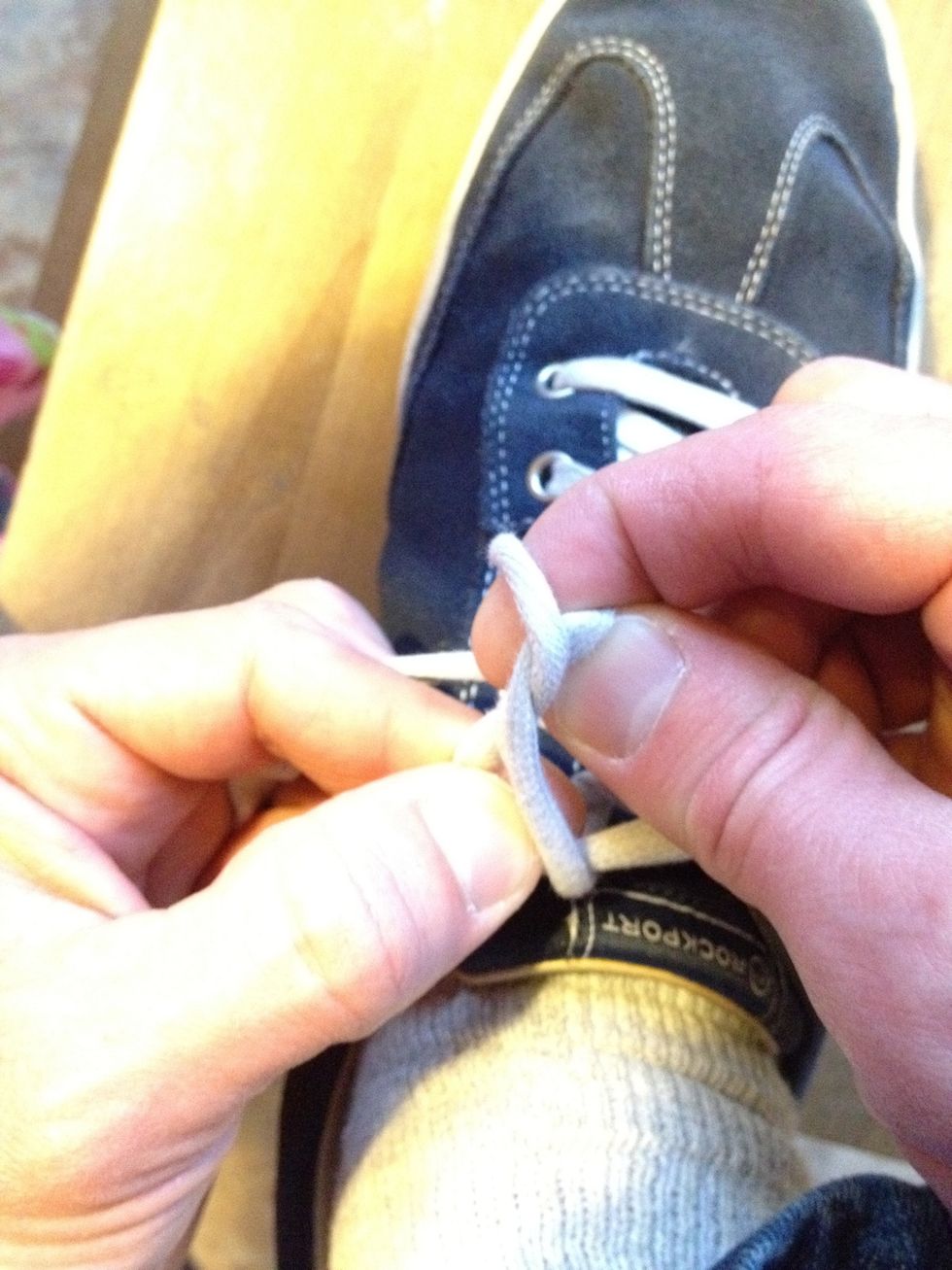 Pull the loops through while gripping tight with your pinky fingers.