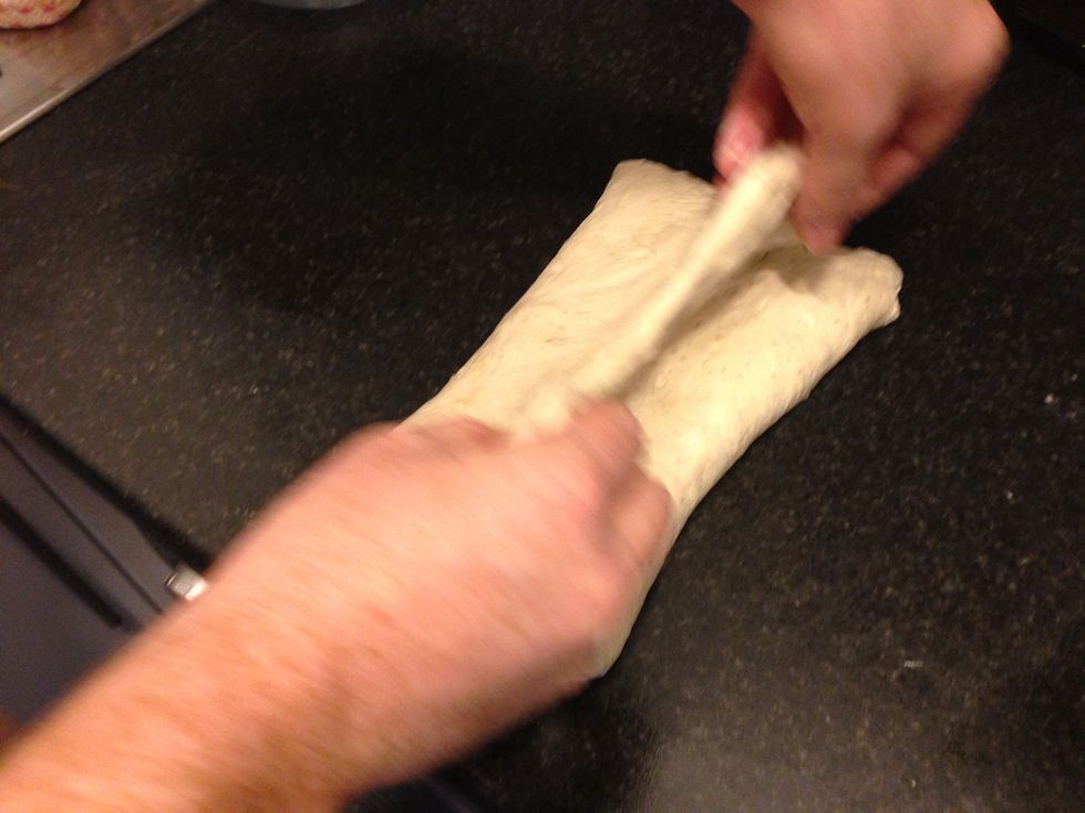 Pull the other edge over so it lines up with the fold.