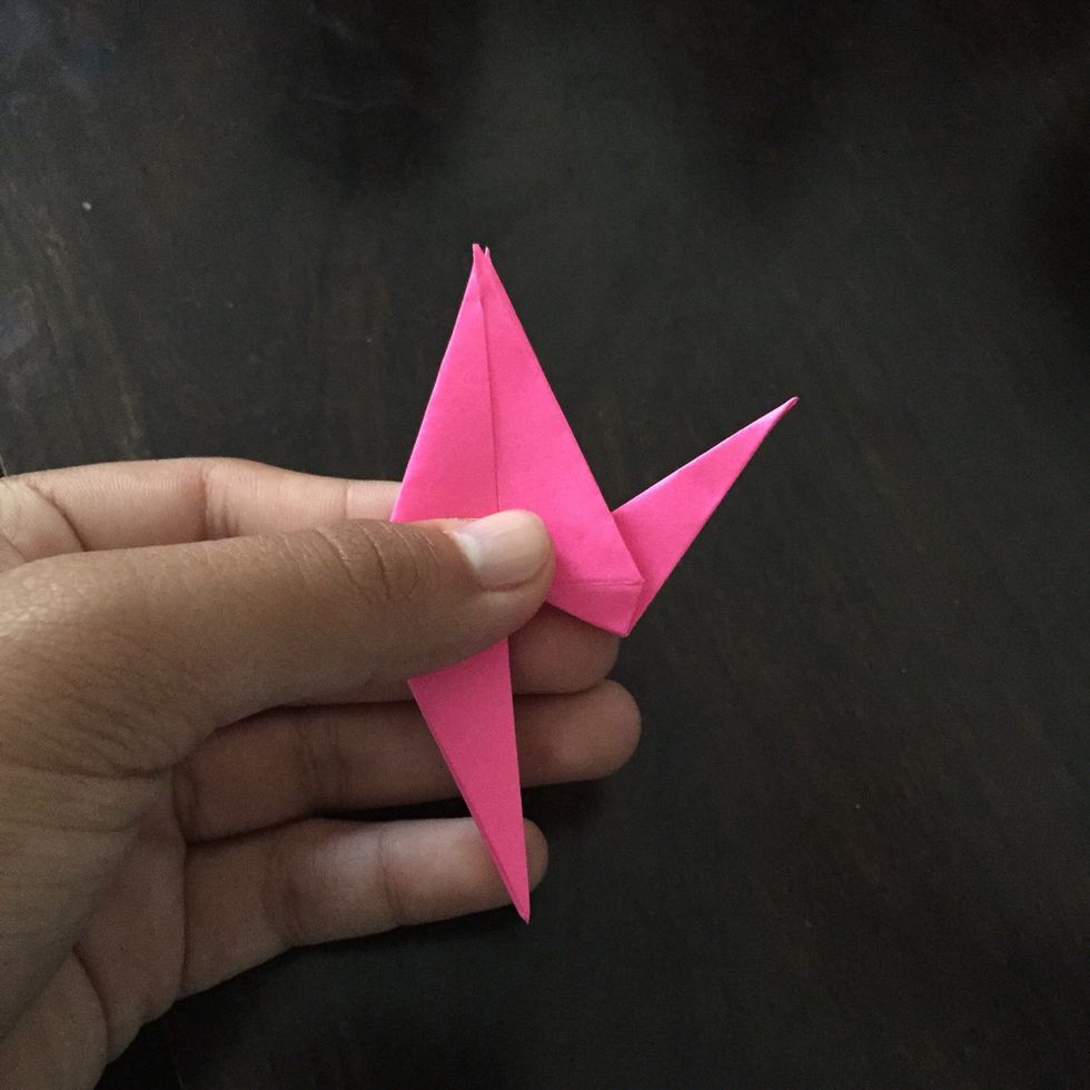 Pull the paper outwards.