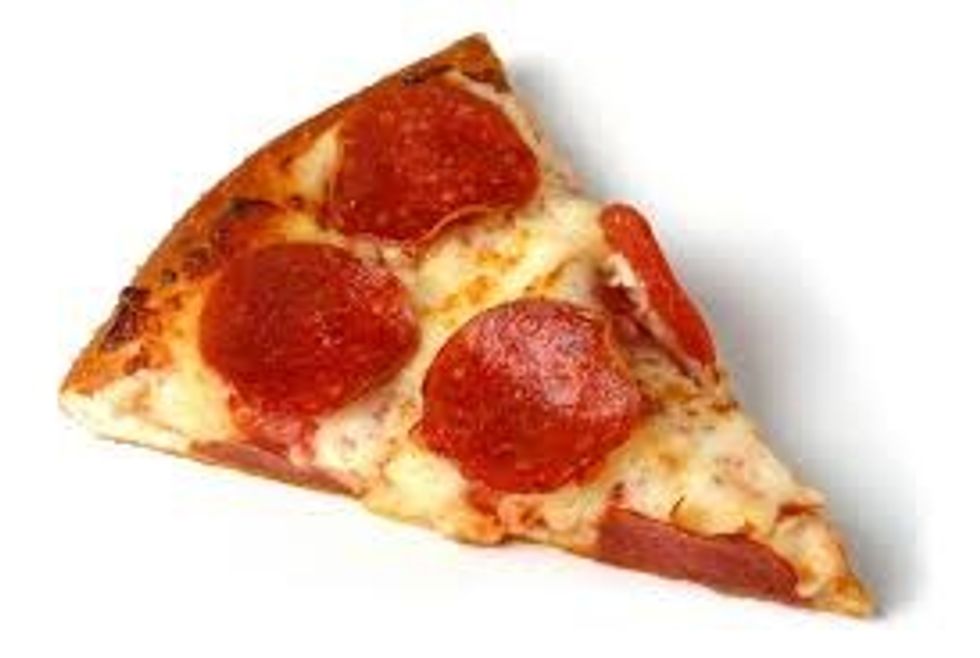 pull the pizza out of the oven. use your pizza cutter to slice the pizza in to slices