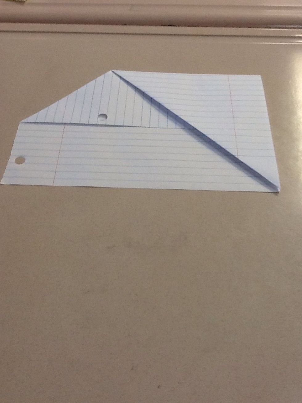 Pull the pointy left corner to the bottom corner, then align sides.