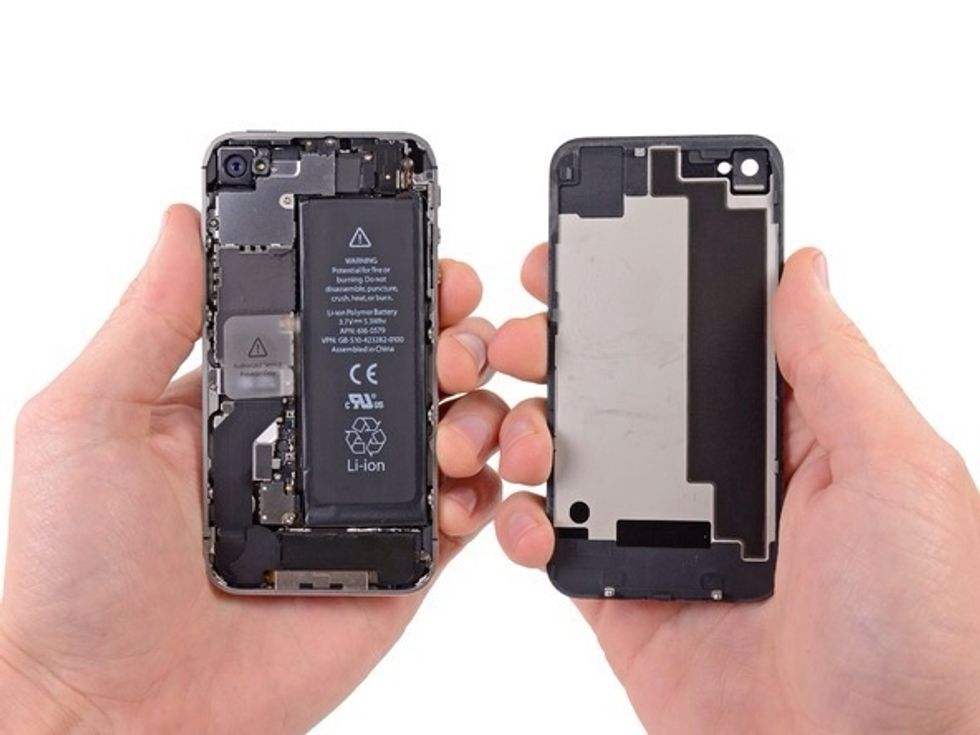 Pull the rear panel away from the back of the iPhone, being careful not to damage to plastic clips attached to the rear panel. Remove the rear panel from the iPhone