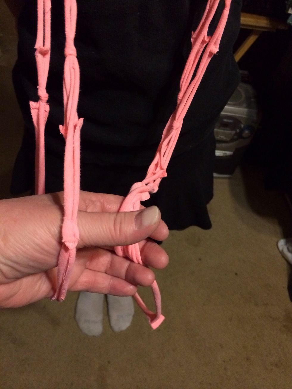 Pull the separated side through the looped side.