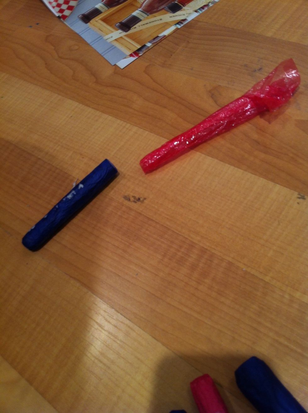 Pull the seran wrap out of the hollow tissue paper tube