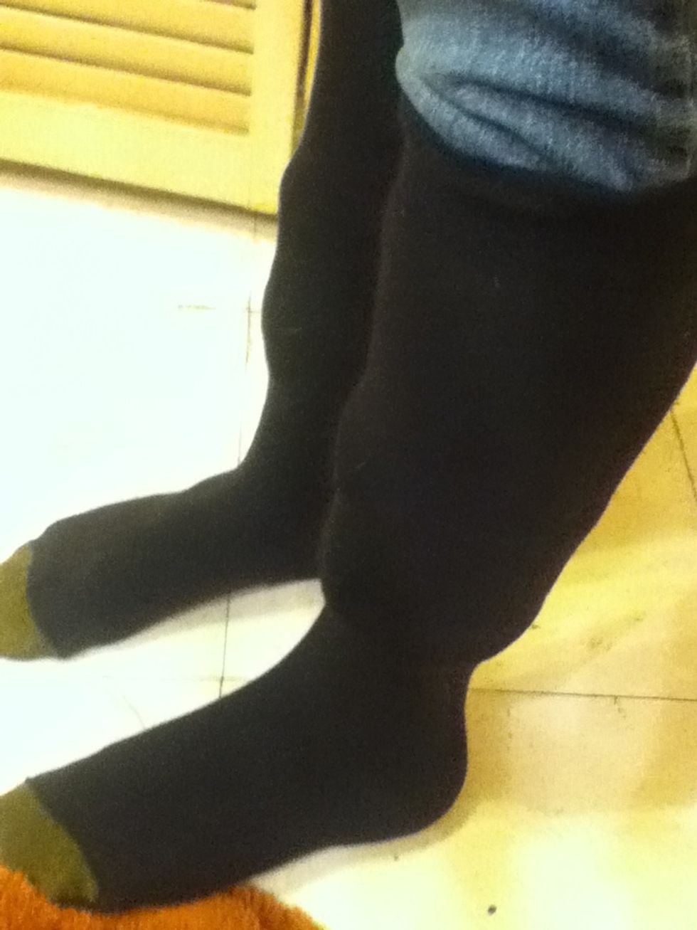 Pull the socks over your folded jeans