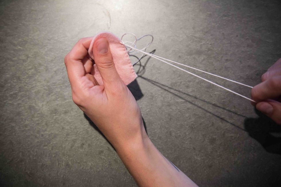 Pull the stitch all the way out, repeating this as many times as necessary to get back to the point where you wish to begin again.