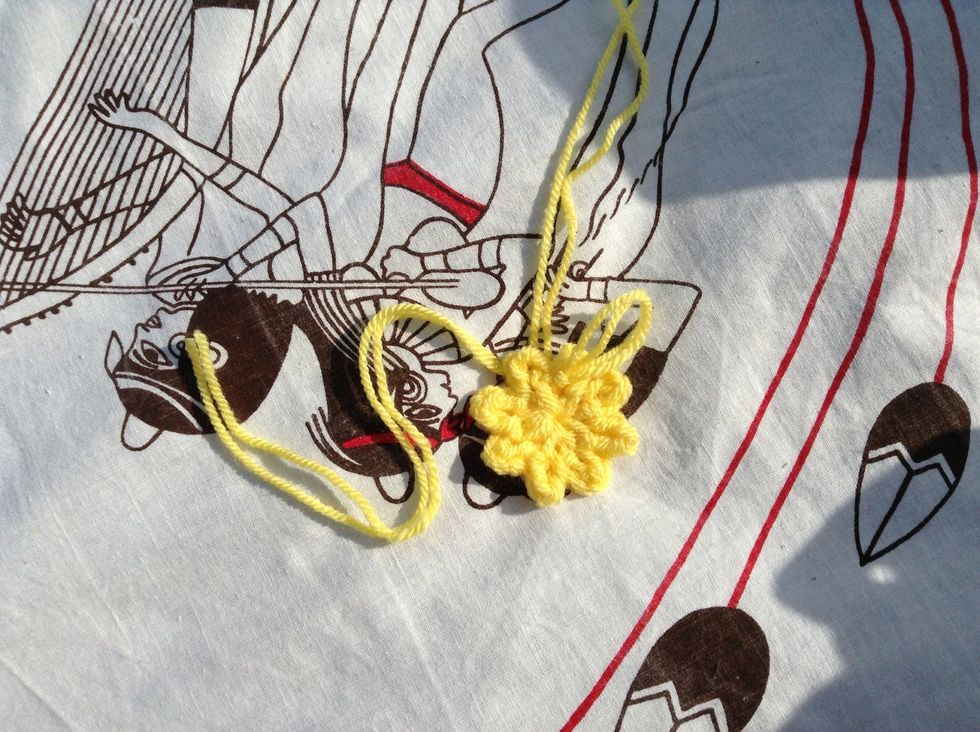 Pull the strand of yarn at the back of your work to cinch the hole closed.