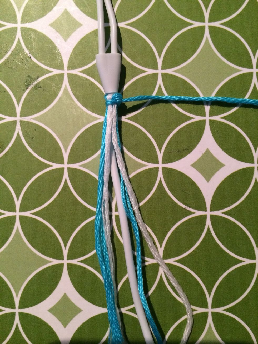 Pull the string all the way to the top. You won't be able to see the first few knots because of the first knot we made at the beginning.