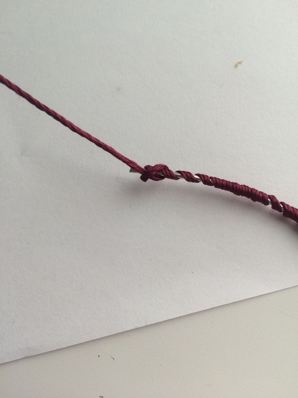 Pull the string until secure enough.