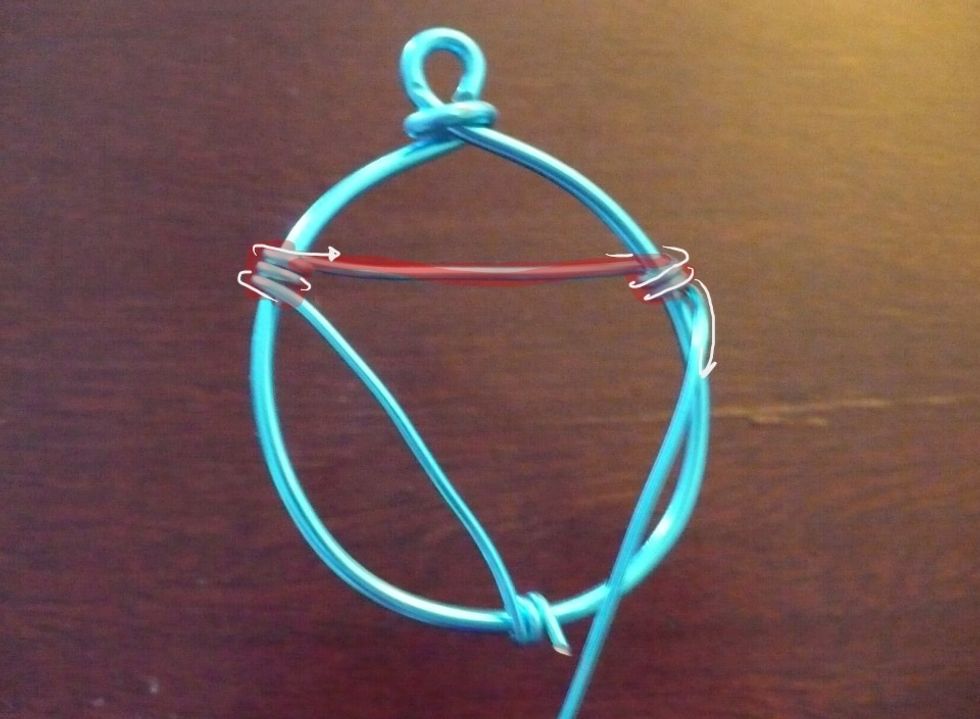 Pull the thin wire over to top left of the frame an wrap twice. Pull behind to the top right and wrap twice.