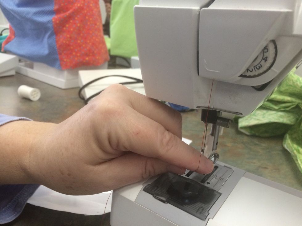 Pull the thread straight down