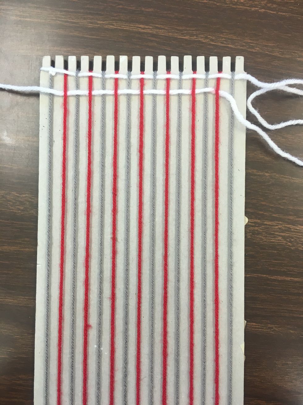 Pull the thread through entirely.
