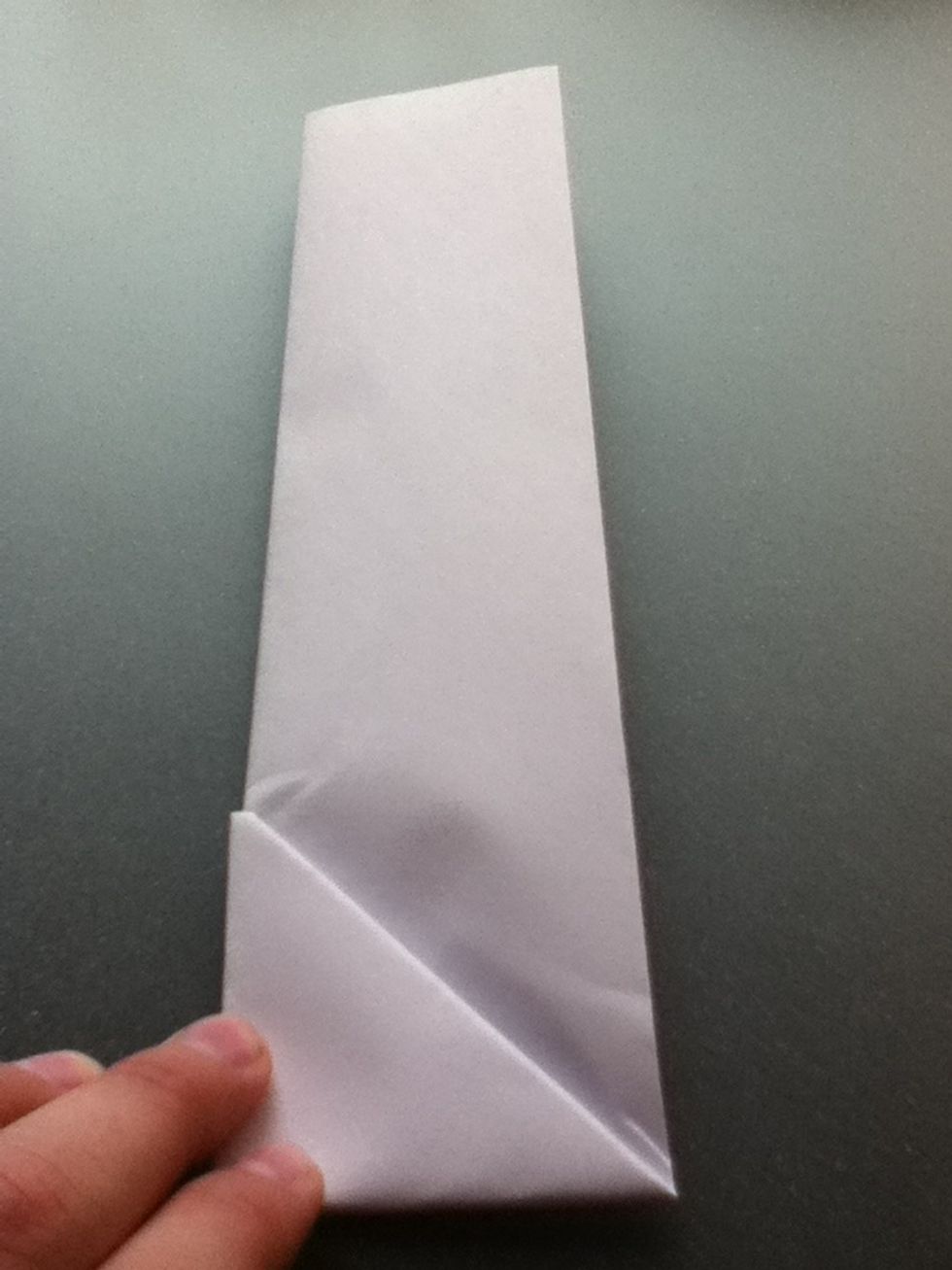 Pull the tip of the triangle up as shown.
