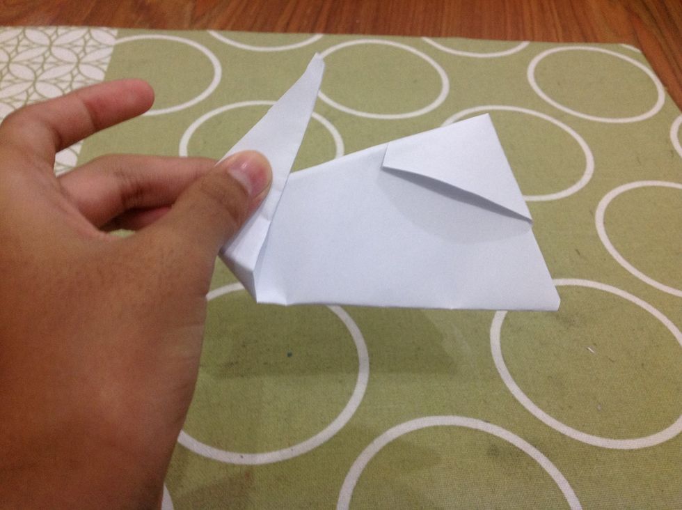 Pull the top part (rabbit ears) up a bit. Crease to stay in place.