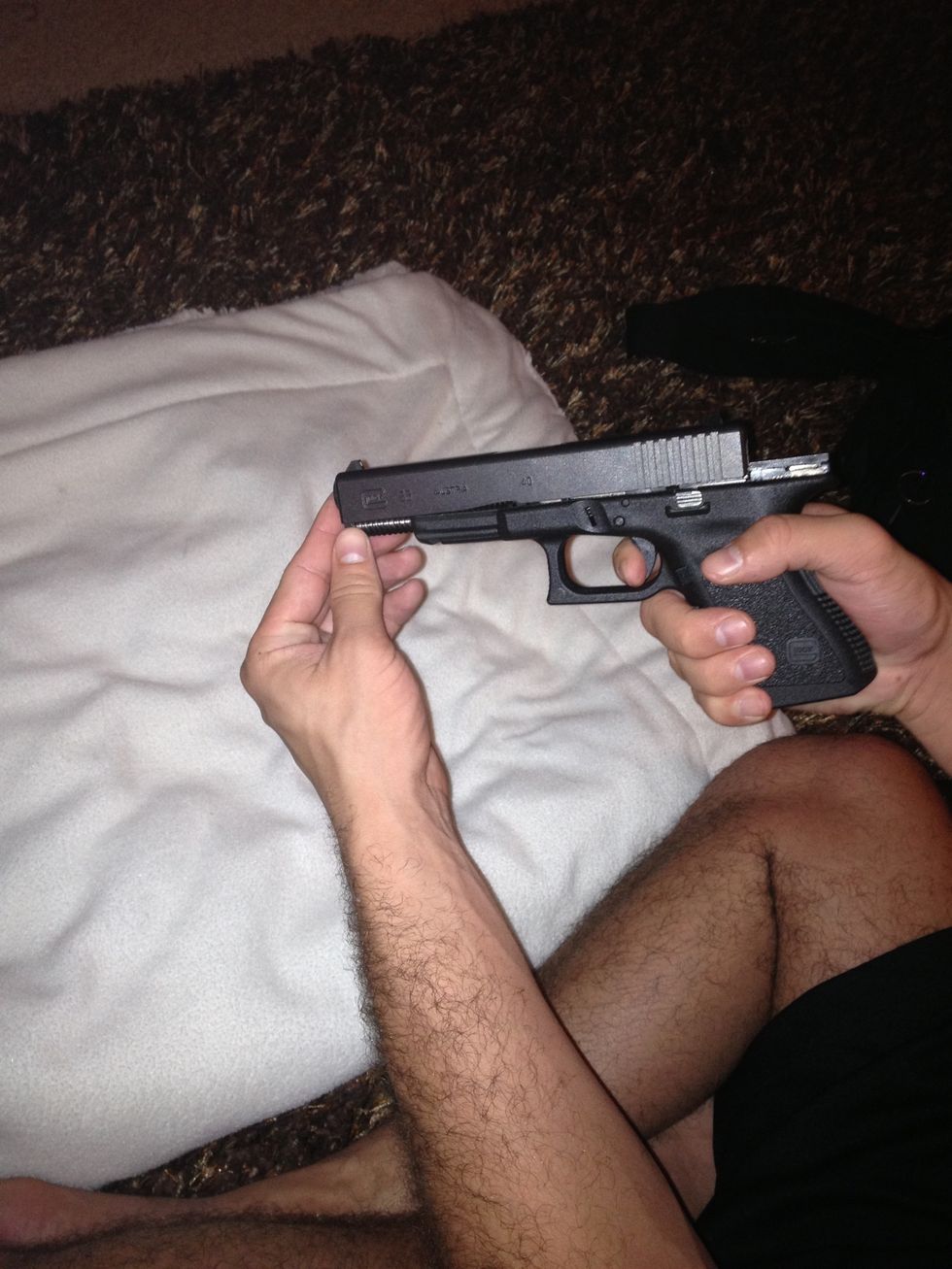 Pull the trigger and let the slide fall forward.