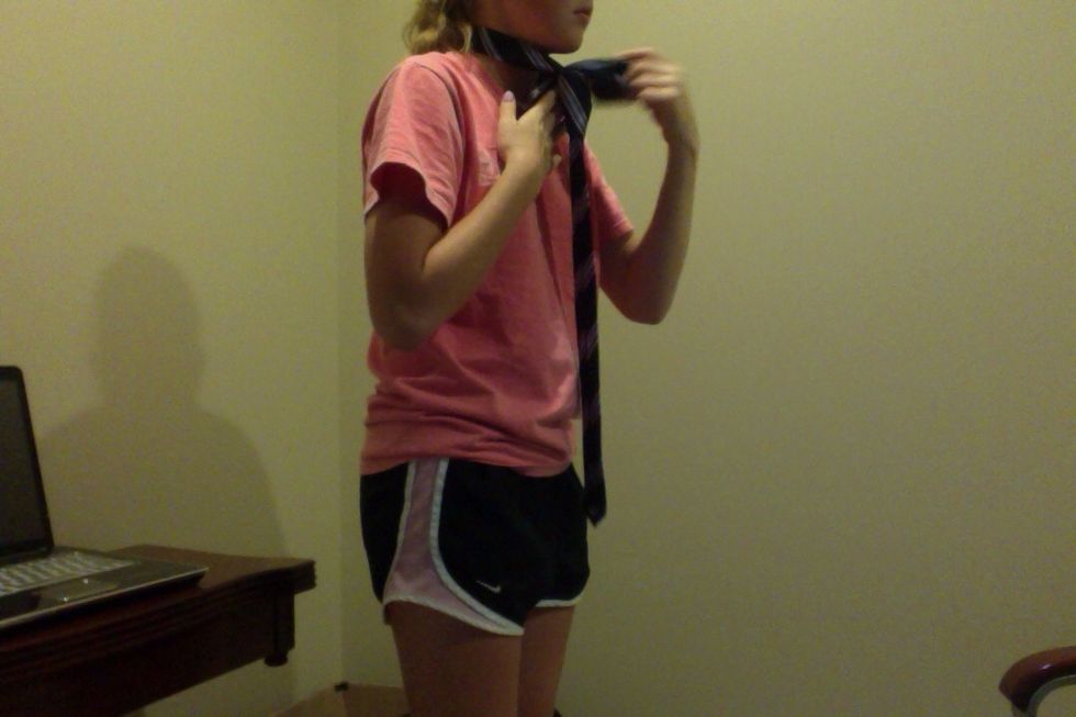 Pull the wide end of the tie through the loop