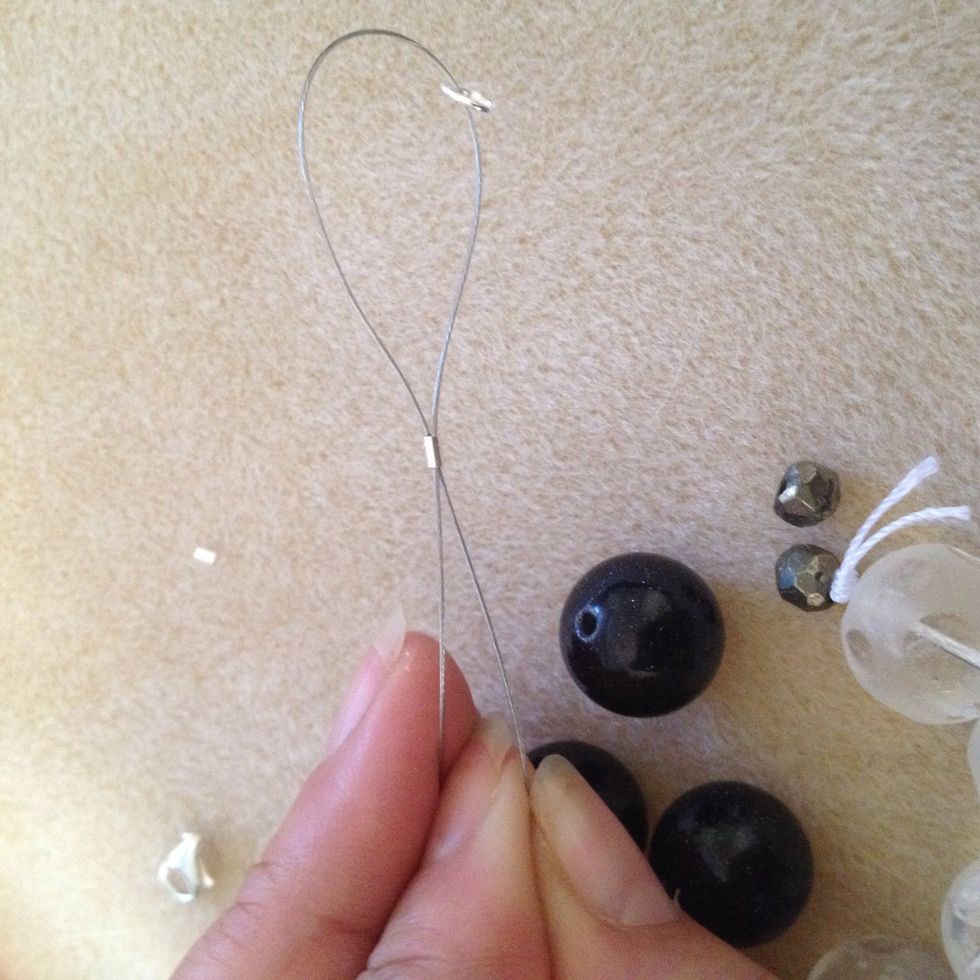 Pull the wire through the clasp until it's all through