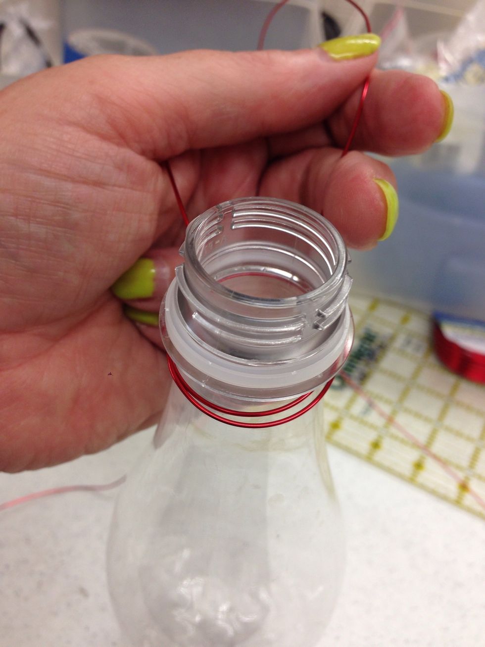 Pull the wires around to the other side of the bottle.