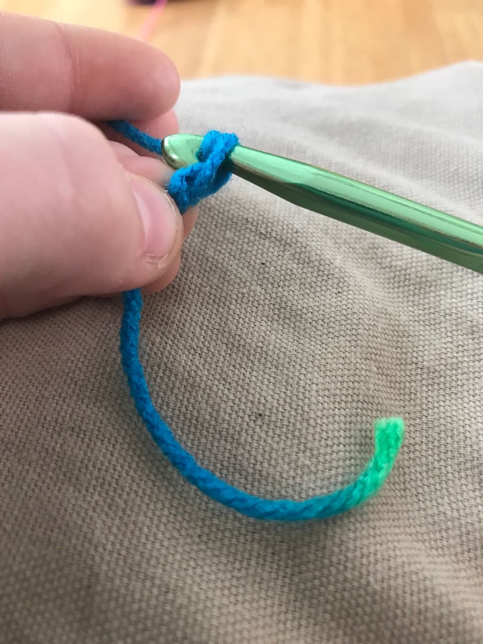 Pull the yarn through