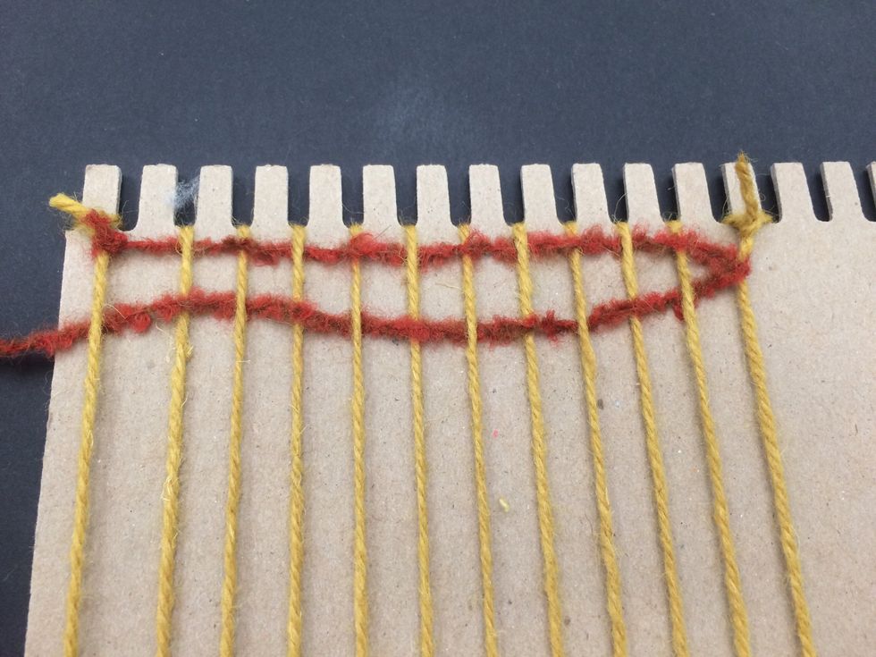 Pull the yarn through.