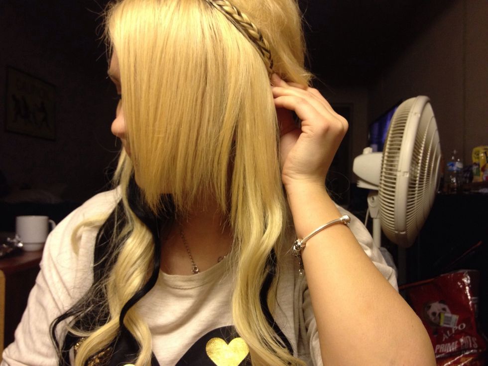 Pull this braid in front of the other and put it where the other braid began.